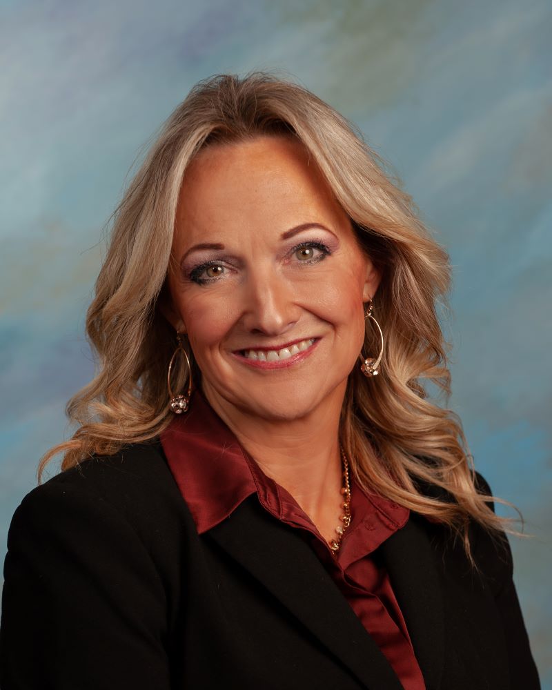 Trustee Peschek smiling