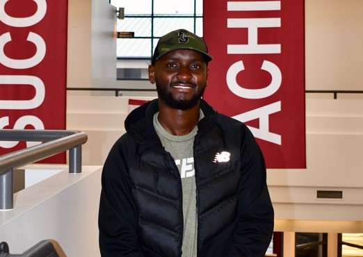 Kimani Dennis smiling in Building I