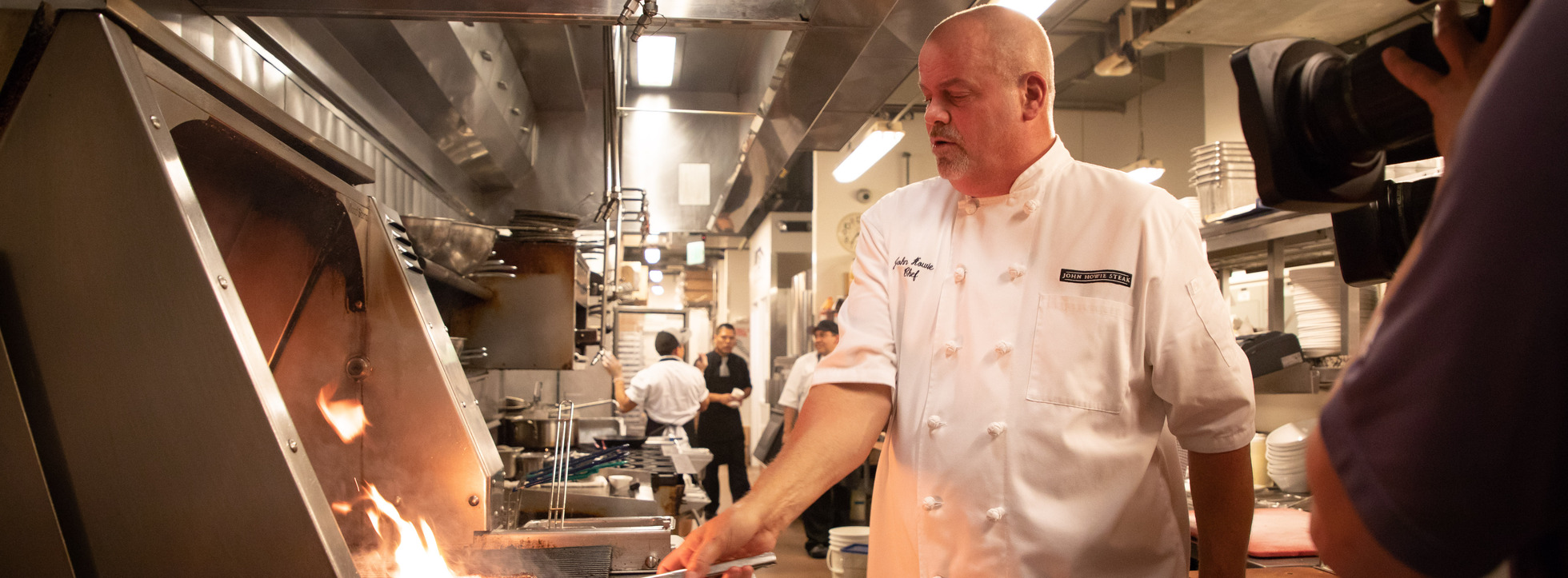 Chef John Howie grilling at a restaurant