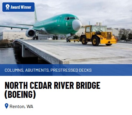 An airplane getting towed across a bridge