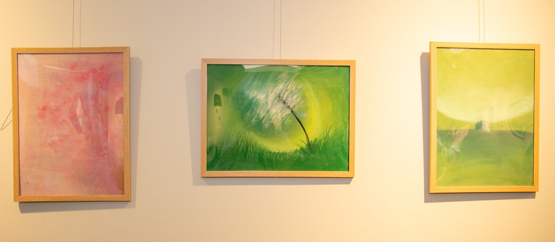 Three pieces of pastel artwork showing vibrant colors