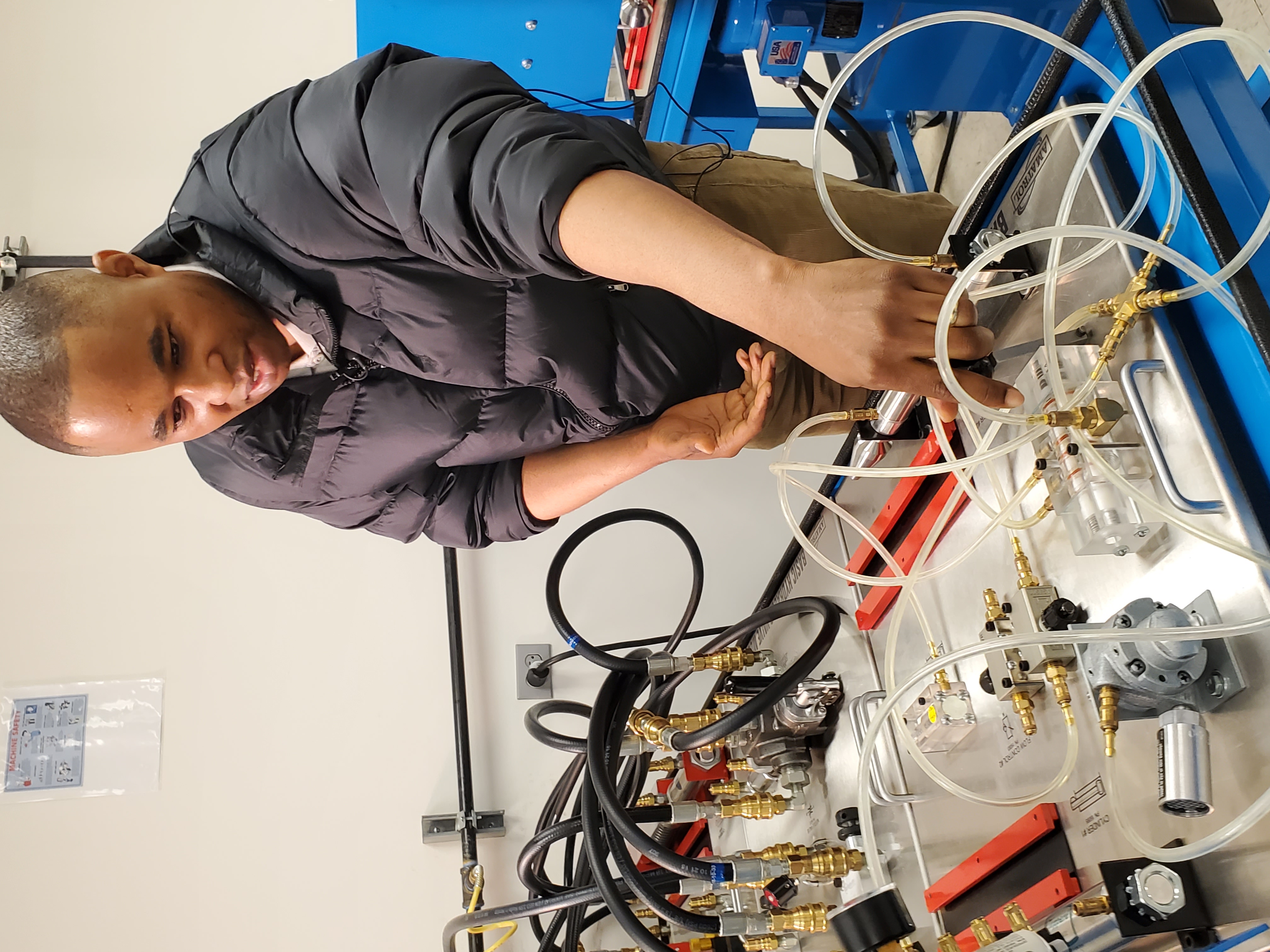 A student using a mechatronics device