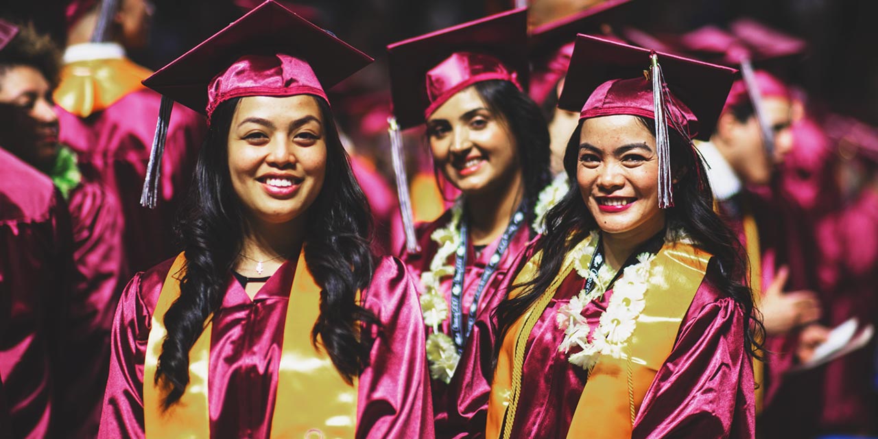 Three smiling RTC graduates