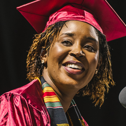RTC student in graduation regalia, smiling